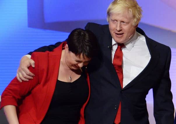 Pals act: Johnson puts his arm around Davidson after the EU debate at Wembley Arena in June last year. Photograph: Stefan Rousseau/Getty