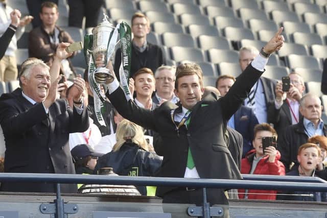 Alan Stubbs lifts the Scottish Cup after leading Hibs to victory over Rangers at Hampden. Picture: Greg Macvean