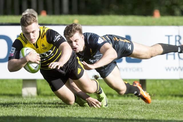 Melroses Ross McCann crosses for the opening try, which he follows up for three more . Photograph: Graham Stuart/SNS Group