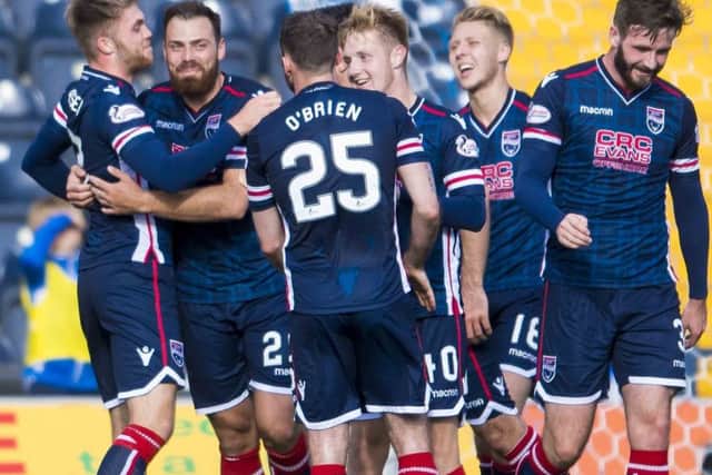 Ross County players mob Kenny van der Weg, second left, after he netted the second goal. Picture: SNS Group