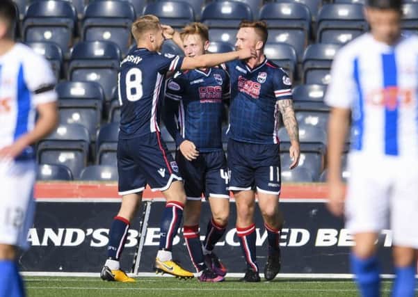 Craig Curran celebrates his opener for Ross County. Picture: SNS Group