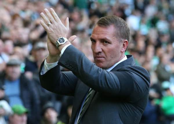 Brendan Rodgers salutes the Celtic fans after the 2-2 draw with Hibs. Picture: PA