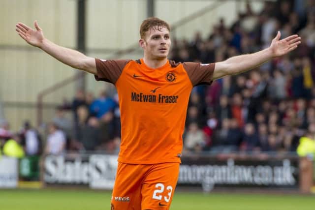 Fraser Fyvie celebrates scoring Dundee Uniteds third goal. Picture: SNS.
