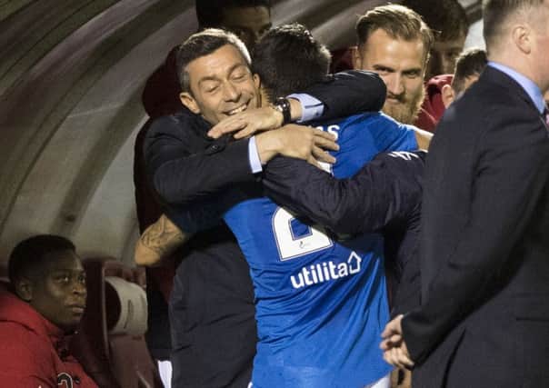 Pedro Caixinha celebrates with Daniel Candeias on Friday. Picture: SNS.