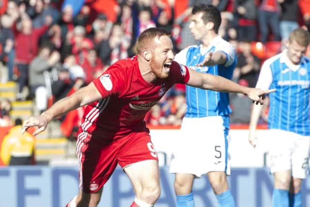 Adam Rooney celebrates opening the scoring against St Johnstone. Picture: SNS.