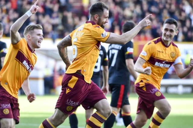 Peter Hartley celebrates scoring Motherwells opening goal. Picture: SNS.