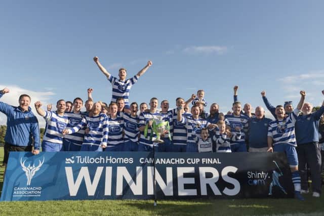 Newtonmore celebrate with the Camanachd Cup after their win over Lovat at The Bught in Inverness. Picture: Neil G Paterson
