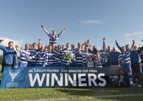 Newtonmore celebrate with the Camanachd Cup after their win over Lovat at The Bught in Inverness. Picture: Neil G Paterson