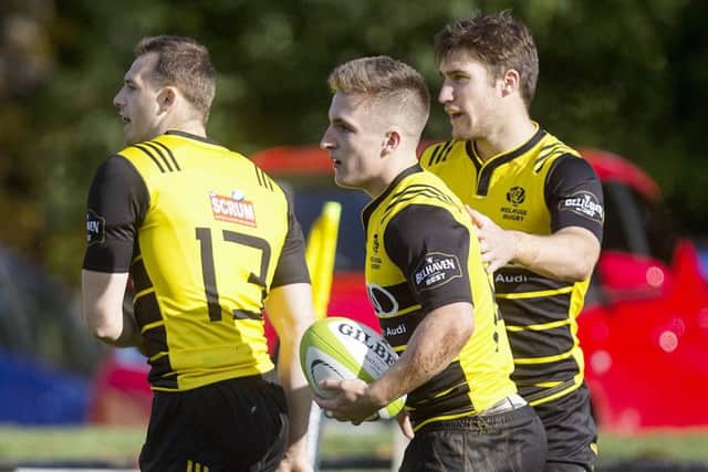 Ross McCann celebrates the first of his four tries on Saturday with Nyle Godsmark and Jason Baggott. Picture: SNS.