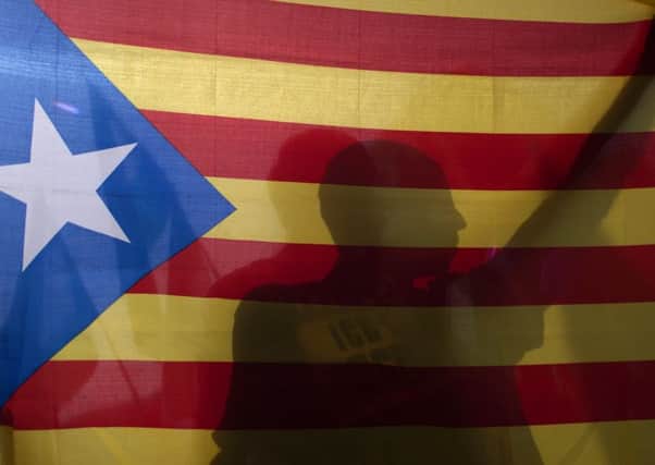 A man holds a Catalan pro-independence 'Estelada' flag during a demonstration in support of the referendum in Catalonia. Picture: AFP/Getty Images