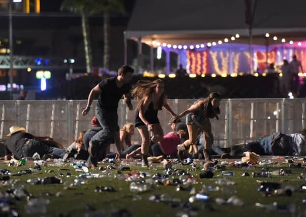 People run from the Route 91 Harvest country music festival in Las Vegas after gun fire was heard. Picture: Getty Images