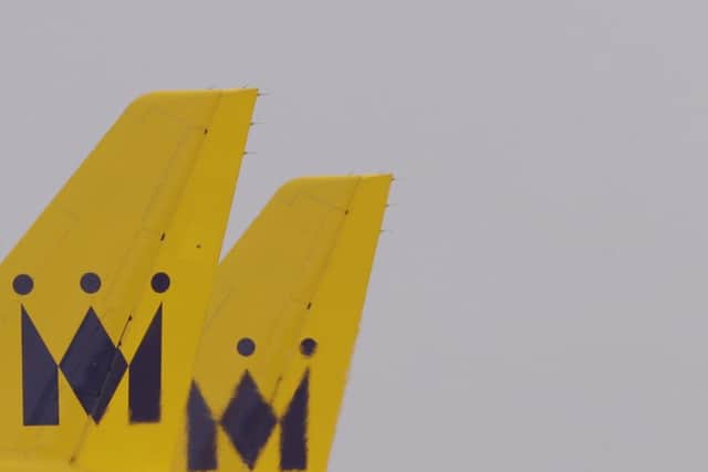 Tail wings of the now suspended Monarch Airlines of two planes at Luton Airport. Picture: AP
