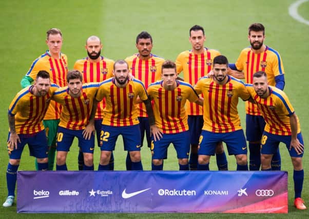 Barcelona's players emerged for the pre-match warm-up wearing shirts in the colours of the Catalan flag ahead of their match with Las Palmas. Picture: Getty Images
