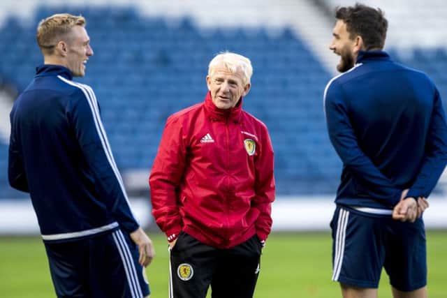 Scotland manager Gordon Strachan, centre, shares a joke with midfielders Darren Fletcher, left, and Robert Snodgrass during a training session at Hampden Park. Picture: Craig Williamson/SNS