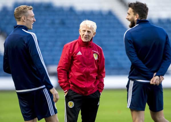 Scotland manager Gordon Strachan, centre, shares a joke with midfielders Darren Fletcher, left, and Robert Snodgrass during a training session at Hampden Park. Picture: Craig Williamson/SNS