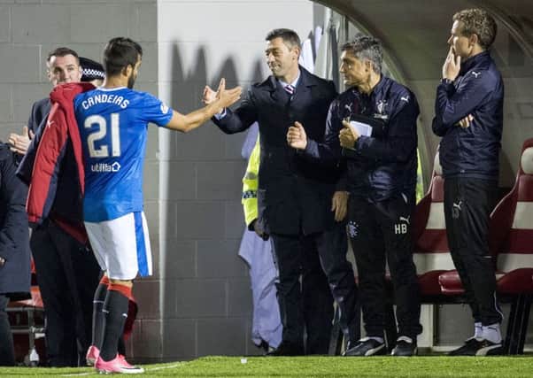 Rangers manager Pedro Caixinha (centre) with Daniel Candeias as the winger is substituted. Picture: SNS