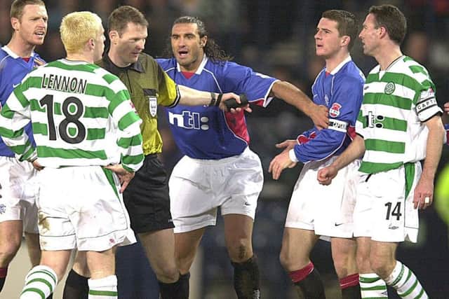 Lorenzo Amoruso (centre) playing peacekeeper and keeping Barry Ferguson and Neil Lennon apart in the 2002 CIS Cup semi-final. Picture: David Moir