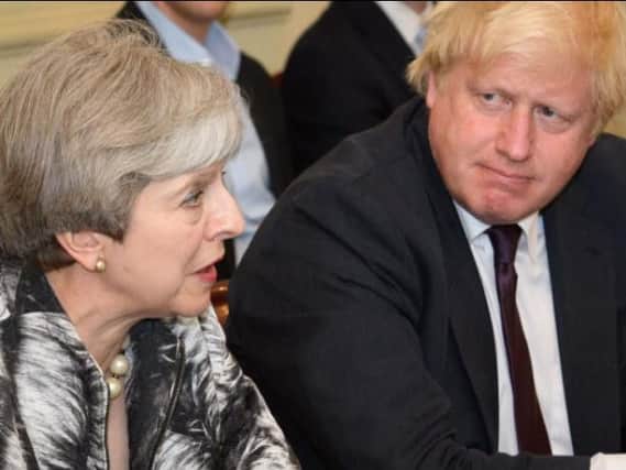 Prime Minister Theresa May and Foreign Secretary Boris Johnson