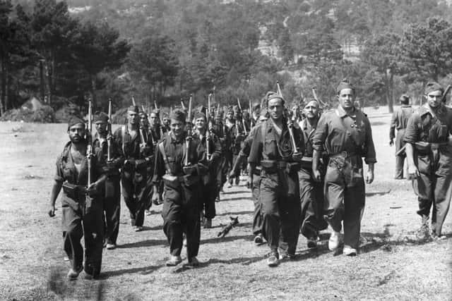 Republican soldiers moving up to the front lines in the Guadarrama Mountains during the Spanish Civil War.  (Photo by Ward/Fox Photos/Getty Images)