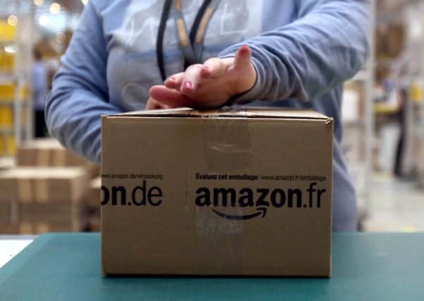 The online retail giant Amazon is facing a bill of at least 250 million euros (Â£221.5 million) in back taxes after the European Commission. Picture: PA