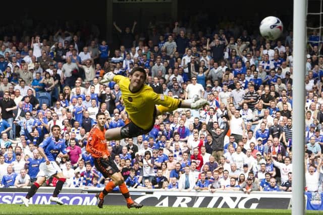 Nacho Novo bends the ball past Lukasz Zaluska to double Rangers' advantage over Dundee United in 2008. Picture: SNS
