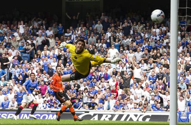 Nacho Novo bends the ball past Lukasz Zaluska to double Rangers' advantage over Dundee United in 2008. Picture: SNS