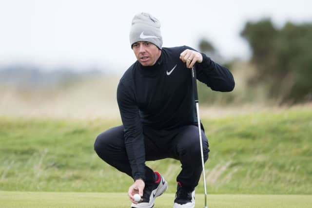 Rory McIlroy lines up a putt during a practice round at St Andrews. Picture: Paul Devlin/SNS