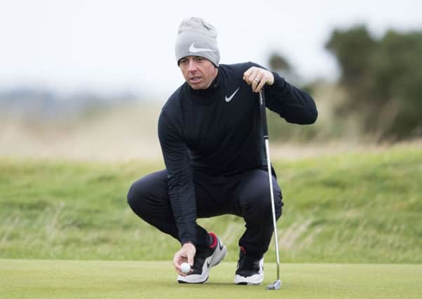 Rory McIlroy lines up a putt during a practice round at St Andrews. Picture: Paul Devlin/SNS