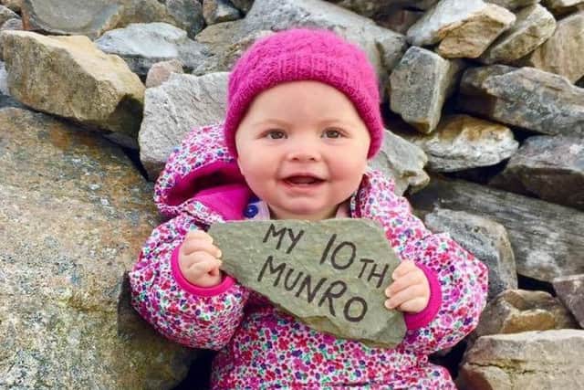 Baby Rebecca Lamb at the top of her 10th Munro, Cairnwell, Highland. Picture: SWNS