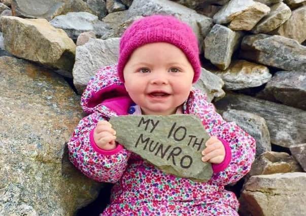 Baby Rebecca Lamb at the top of her 10th Munro, Cairnwell, Highland. Picture: SWNS