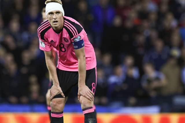 Scotland captain Darren Fletcher sports a bandaged head after sustaining a nasty cut to his ear from a Slovakian elbow.  Picture: Craig Williamson/SNS