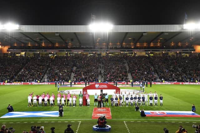 The two teams line up for the anthems on what proved to be a memorable night at Hampden. Picture: SNS.