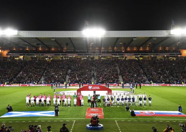 The two teams line up for the anthems on what proved to be a memorable night at Hampden. Picture: SNS.
