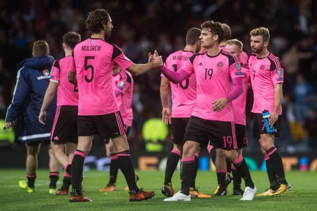 Charlie Mulgrew, left, and Chris Martin embrace after the full-time whistle. Picture: John Devlin