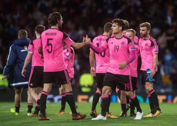Charlie Mulgrew, left, and Chris Martin embrace after the full-time whistle. Picture: John Devlin