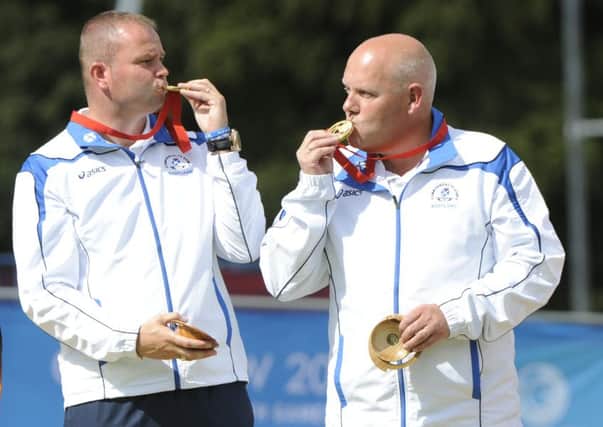 Alex Marshall and Paul Foster with their Commonwealth Games gold medal. Picture: Andrew O'Brien