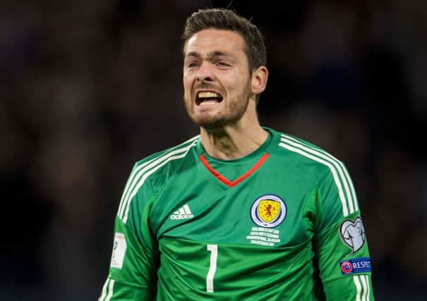 Craig Gordon celebrates after Martin Skrtel's own goal put Scotland in front against Slovakia. Picture: Bill Murray/SNS