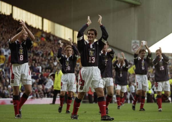 Paul Lambert, left, and Tosh McKinlay, centre, salute the Scotland fans after all but securing a place at the 1998 World Cup finals. Picture: Gareth Reid/SNS