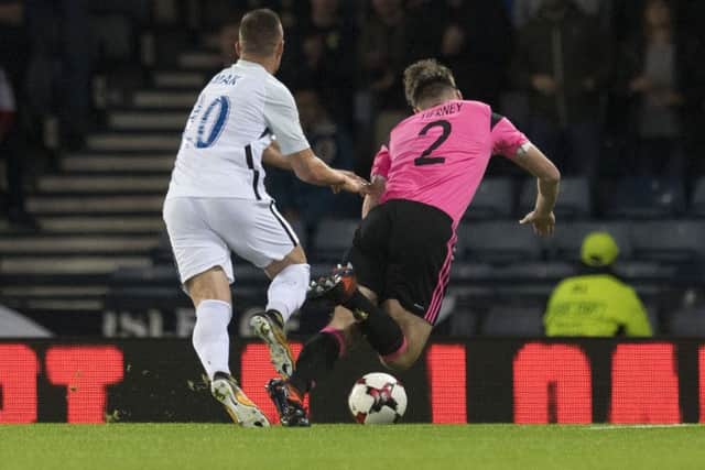 Kieran Tierney goes down under the challenge of Robert Mak. Picture: SNS