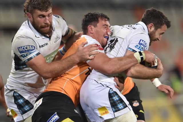 Callum Gibbins and Tommy Seymour of Glasgow Warriors get to grips with Henco Venter of the Toyota Cheetahs during the Guinness Pro14 match in Bloemfontein. Picture: Johan Pretorius/Gallo Images