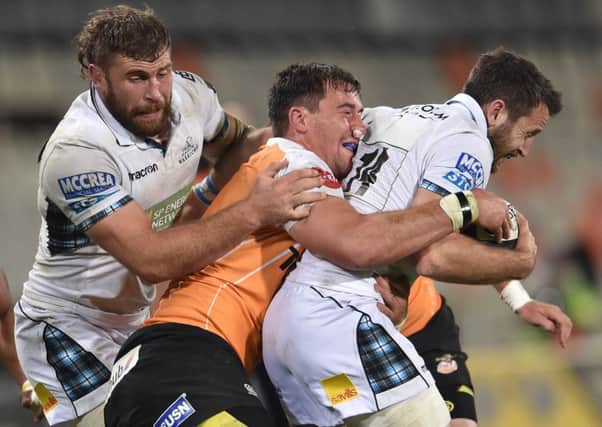 Callum Gibbins and Tommy Seymour of Glasgow Warriors get to grips with Henco Venter of the Toyota Cheetahs during the Guinness Pro14 match in Bloemfontein. Picture: Johan Pretorius/Gallo Images