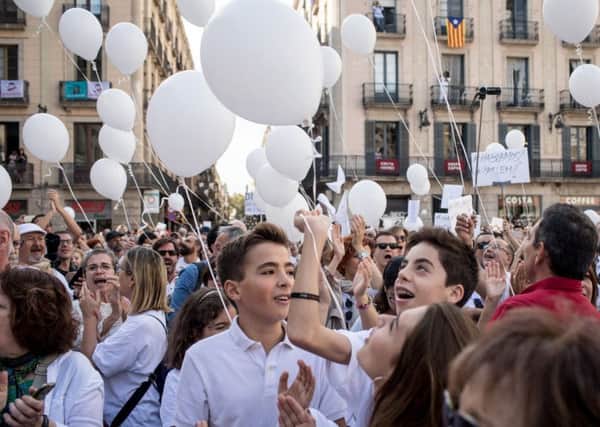 The white-clad crowd in Barcelona chanted Lets talk. Picture: Getty