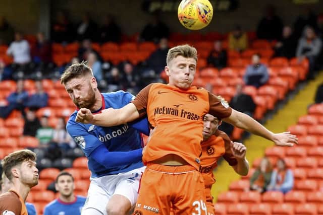 Linfield's Mark Stafford and Dundee United's Gavin Ritchie. Picture: Rob Casey/SNS