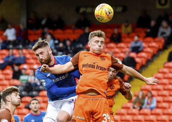 Linfield's Mark Stafford and Dundee United's Gavin Ritchie. Picture: Rob Casey/SNS