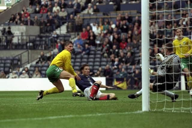Gary McSwegan slides in to net for Scotland against Lithuania in qualifying for the 2000 European Championships. Picture: Alex Livesey/Allsport