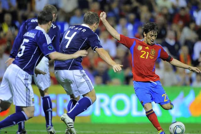 Spain's forward David Silva teases Scotland during qualification for the 2012 European Championships. Picture: JOSE JORDAN/AFP/Getty Images