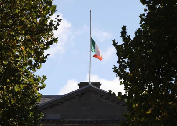 Flags fly at half mast at Leinster House in Dublin after the death of former Taoiseach Liam Cosgrave. Picture: PA
