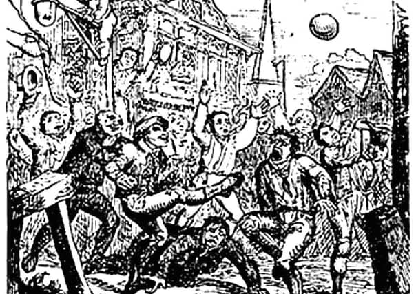 Detail of an etching of a game of street-style football being played during the medieval era. PIC: Creative Commons.