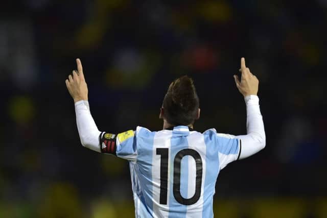 Lionel Messi wheels away in delight as his goals send Argentina to the 2018 World Cup finals