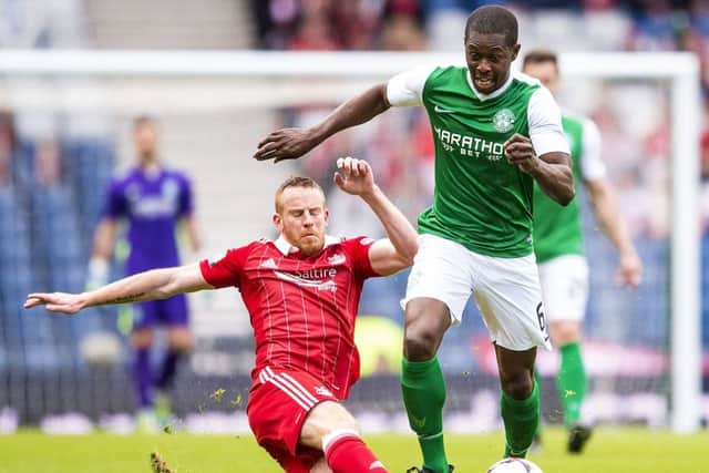 Aberdeen got the better of Hibs in last season's Scottish Cup semi-final. Marvin Bartley is tackled by Adam Rooney. Picture: Bill Murray/SNS